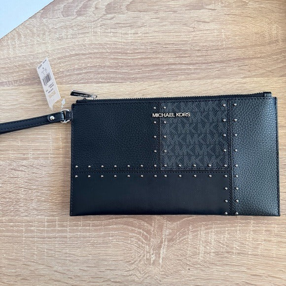 Michael Kors Large Jet Set Travel wristlet bag with patches, studs
