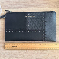 Michael Kors Large Jet Set Travel wristlet bag with patches, studs