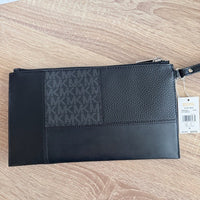 Michael Kors Large Jet Set Travel wristlet bag with patches, studs