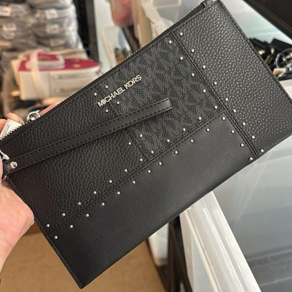 Michael Kors Large Jet Set Travel wristlet bag with patches, studs